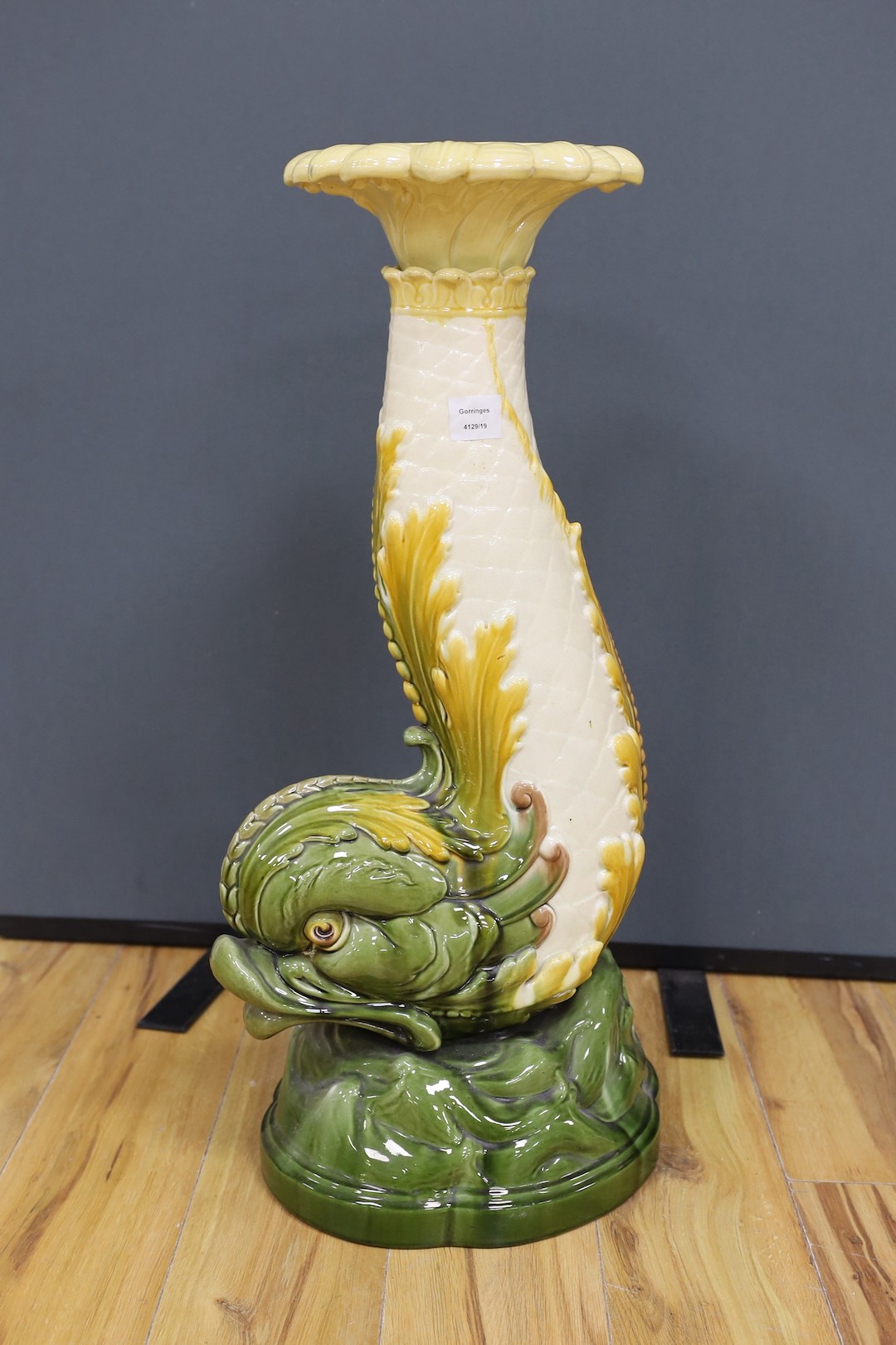 A Leeds Art pottery floral jardinière, on rearing dolphin pedestal - 114cm high